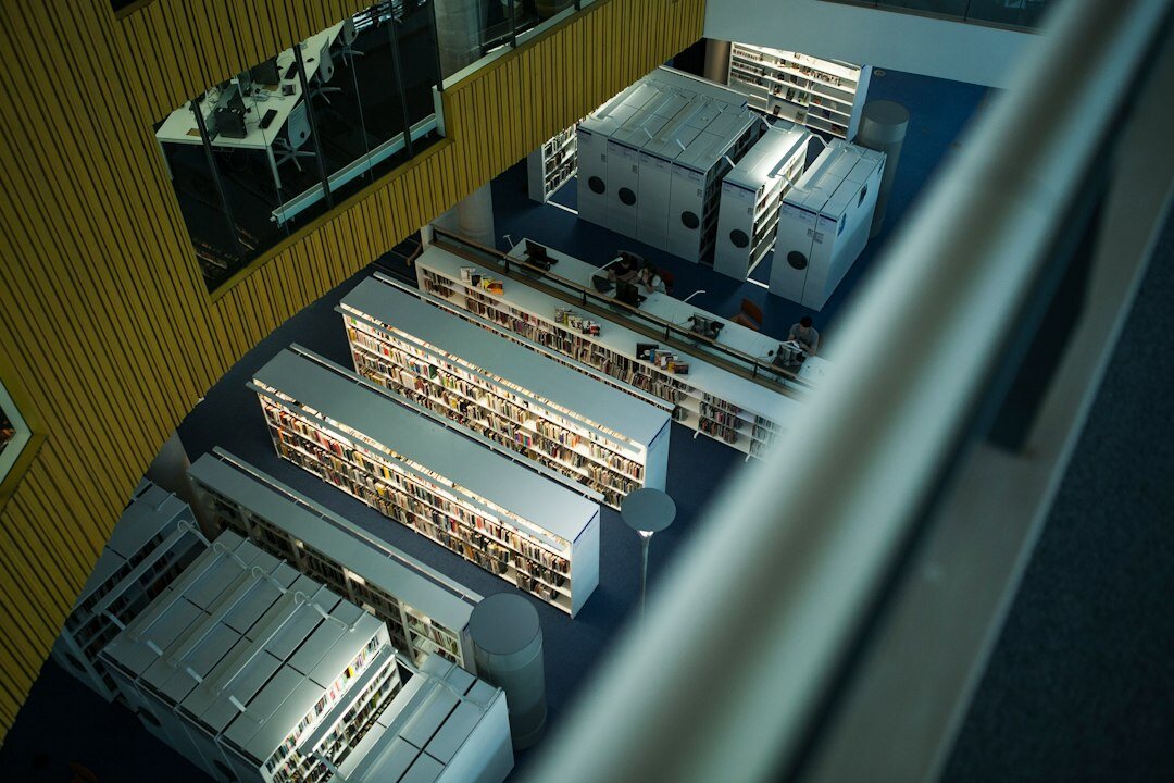 Multi-camera control room with rows of broadcast monitors